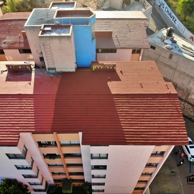 Impermeabilización en edificio con productos acrílicos base agua color terracota