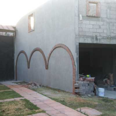 Aplanados y arcos de ladrillo